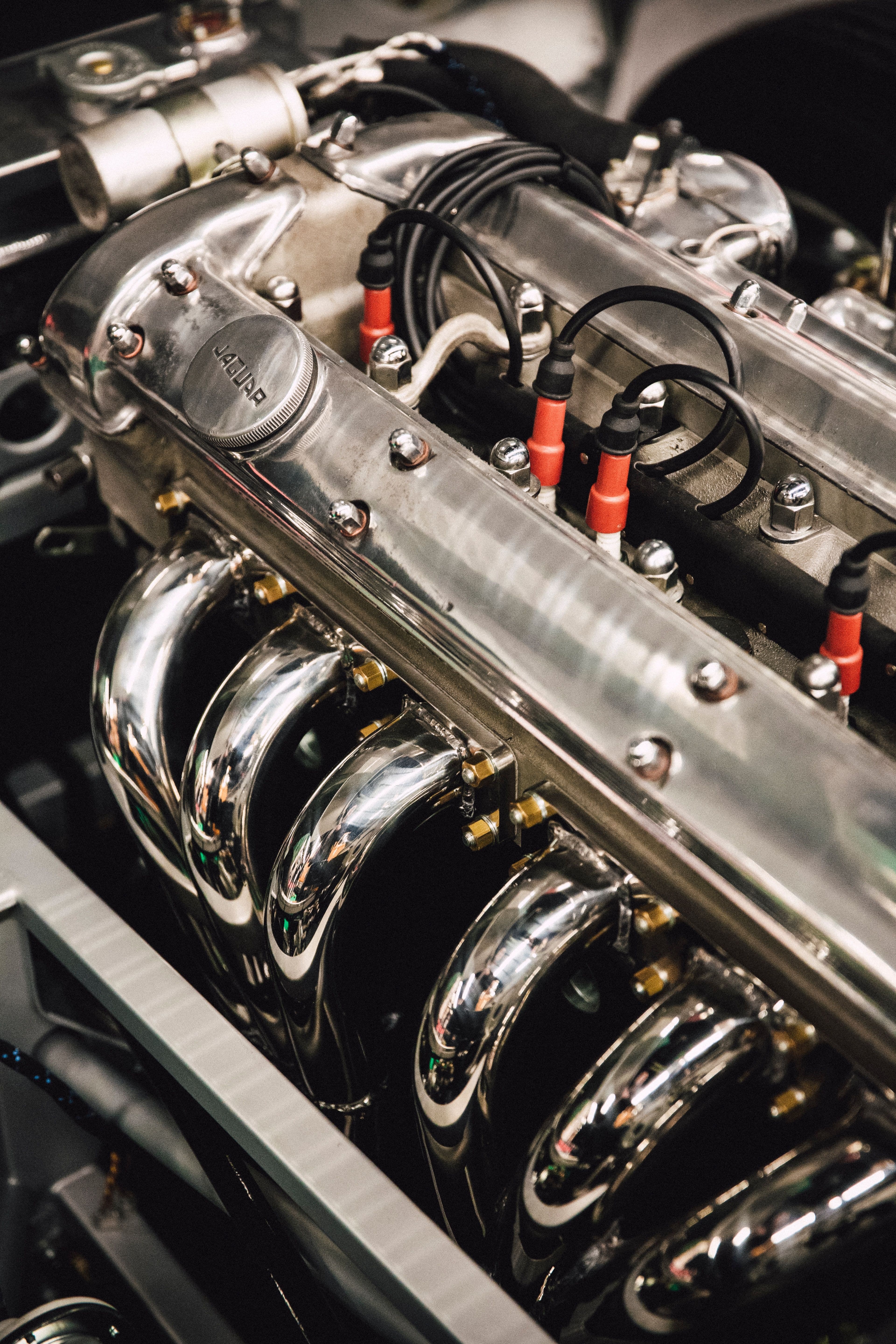 a close up of a car engine with the word jaguar on it